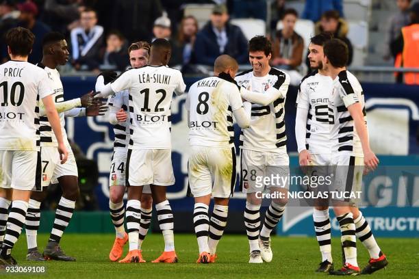 Rennes' players celebrate after scoring a goal during the French L1 football match between Bordeaux and Rennes on March 17 at the Matmut Atlantique...