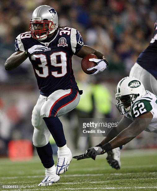Laurence Maroney of the New England Patriots avoids David Harris of the New York Jets on November 22, 2009 at Gillette Stadium in Foxboro,...