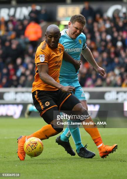 Benik Afobe of Wolverhampton Wanderers and Jake Buxton of Burton Albion during the Sky Bet Championship match between Wolverhampton Wanderers and...