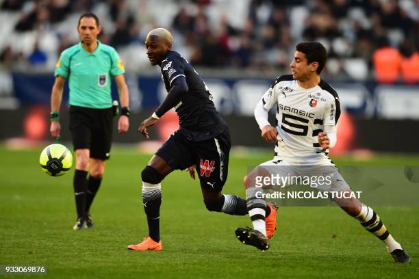 Rennes' French midfielder Benjamin Andre vies with Bordeaux's Senegalese midfielder Younousse Sankhare during the French L1 football match between...