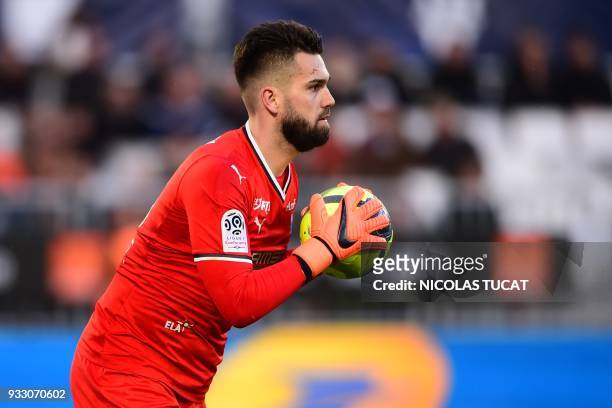 Rennes' Czech goalkeeper Tomas Koubek grabs the ball during the French L1 football match between Bordeaux and Rennes on March 17 at the Matmut...