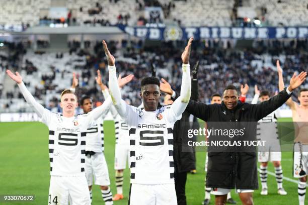 Rennes' French forward Ismaila Sarr celebrates with fans after winning during the French L1 football match between Bordeaux and Rennes on March 17 at...