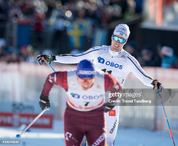 Calle Halfvarsson of Sweden, Alexander Bolshunov of Russia during 15 km Men Mass Start Classic at Lugnet Stadium on March 17, 2018 in Falun, Sweden.