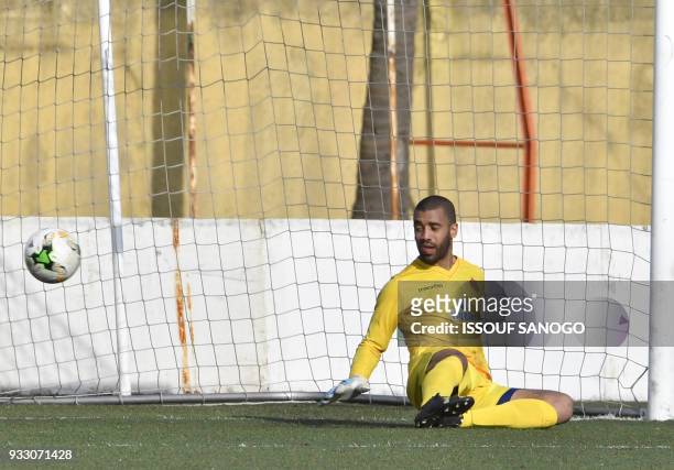 Morocco goalkeeper Laaroubi Zouhair concedes a goal during the CAF Champions league football match between Williamsville Athletic Club and Wydad...