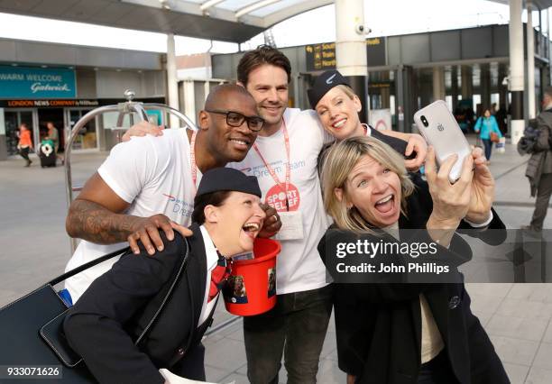 Ugo Monye and Ben Foden pose with British Airways staff, and unexpected customer Zoe Ball at Gatwick Airport whilst raising money for Sport Relief on...