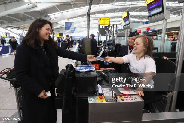 Ellie Simmonds helps British Airways customers at Heathrow Airport Terminal 5 by assisting guests to check in to raise money for Sport Relief on...