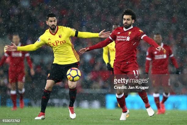 Miguel Britos of Watford and Mohamed Salah of Liverpool battle for the ball during the Premier League match between Liverpool and Watford at Anfield...