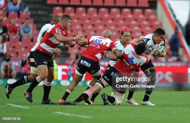 Lourens Erasmus, Lionel Mapoe and Malcom Marx of Lions in action with Hosea Saumaki of Sunwolves during the Super Rugby match between Emirates Lions...