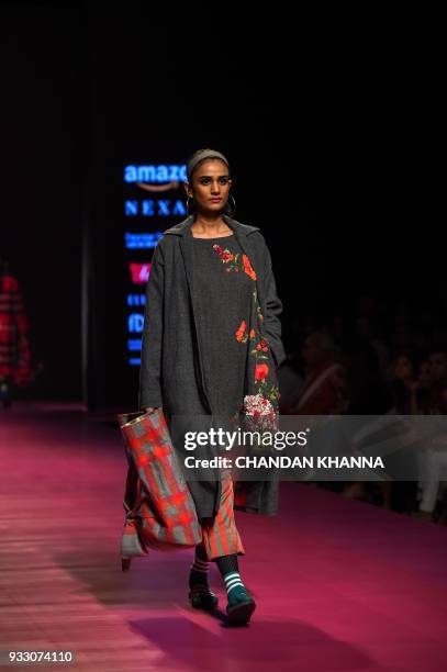Model presents a creation by Indian fashion designer Aneeth Arora during the Amazon India Fashion Week Autumn/Winter 2018 in New Delhi on March 17,...