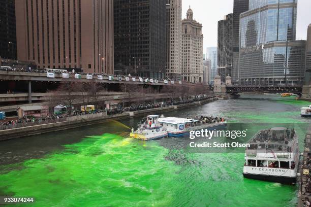 Members of the local plumber's union dye the Chicago River green in celebration of St. Patrick's Day on March 17, 2018 in Chicago, Illinois. Dyeing...