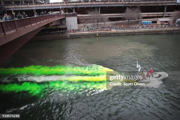 Members of the local plumber's union dye the Chicago River green in celebration of St. Patrick's Day on March 17, 2018 in Chicago, Illinois. Dyeing...