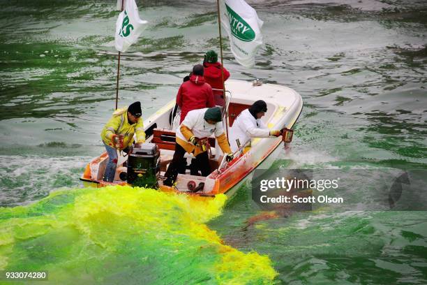 Members of the local plumber's union dye the Chicago River green in celebration of St. Patrick's Day on March 17, 2018 in Chicago, Illinois. Dyeing...