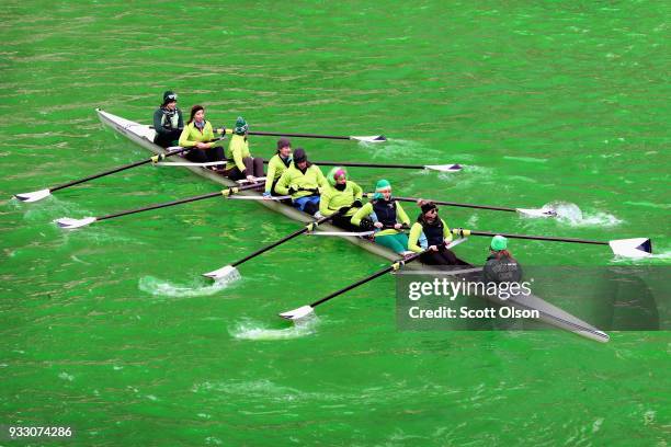 Rowers navigate the Chicago River shortly after it was dyed green in celebration of St. Patrick's Day on March 17, 2018 in Chicago, Illinois. Dyeing...