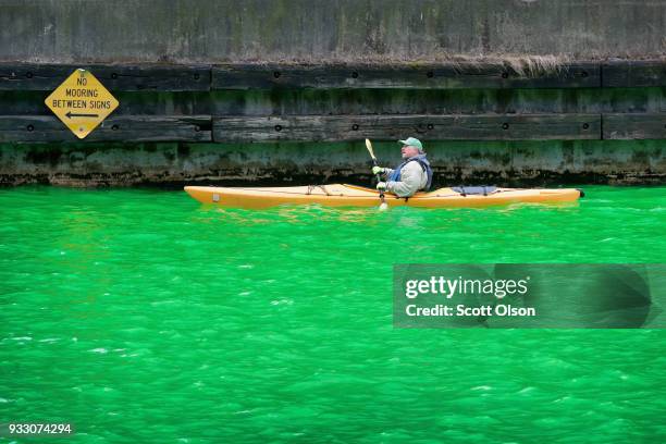 Kayaker navigates the Chicago River shortly after it was dyed green in celebration of St. Patrick's Day on March 17, 2018 in Chicago, Illinois....