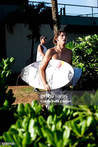 Bruce Irons of Hawaii runs through the foliage at Haleiwa for his morning heat of the REEF Hawaiian Pro on November 22, 2009 in Haleiwa, Hawaii.