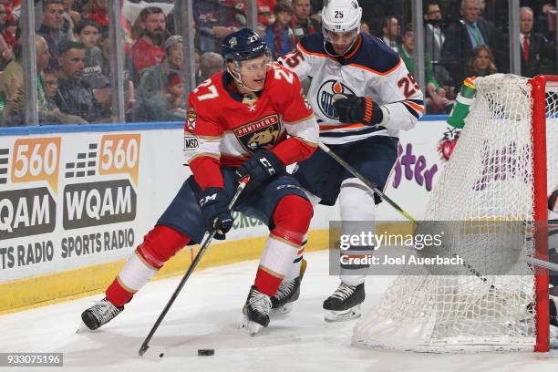 Darnell Nurse of the Edmonton Oilers defends against Nick Bjugstad of the Florida Panthers during first period action at the BB&T Center on March 17,...