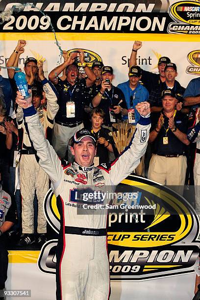 Jimmie Johnson, driver of the Lowe's Chevrolet, celebrates after winning the NASCAR Sprint Cup Series Championship after finishing in fifth place in...