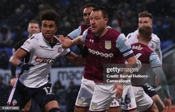 Aston Villa John Terry and Bolton Wanderers' Derik Osede during the Sky Bet Championship match between Bolton Wanderers and Aston Villa at Macron...