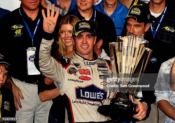 Jimmie Johnson, driver of the Lowe's Chevrolet, celebrates after winning the NASCAR Sprint Cup Series Championship after finishing in fifth place in...