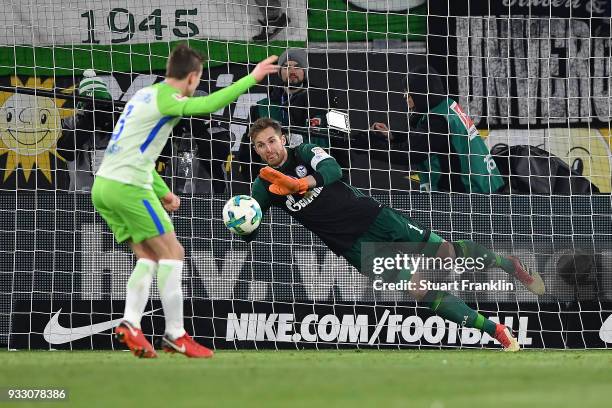 Goalkeeper Ralf Faehrmann of Schalke saves a penalty against Paul Verhaegh of Wolfsburg during the Bundesliga match between VfL Wolfsburg and FC...