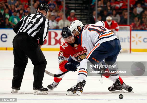 Denis Malgin of the Florida Panthers faces off against Jujhar Khaira of the Edmonton Oilers at the BB&T Center on March 17, 2018 in Sunrise, Florida.
