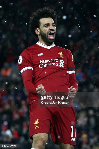 Mohamed Salah of Liverpool celebrates scoring his side's fourth goal during the Premier League match between Liverpool and Watford at Anfield on...