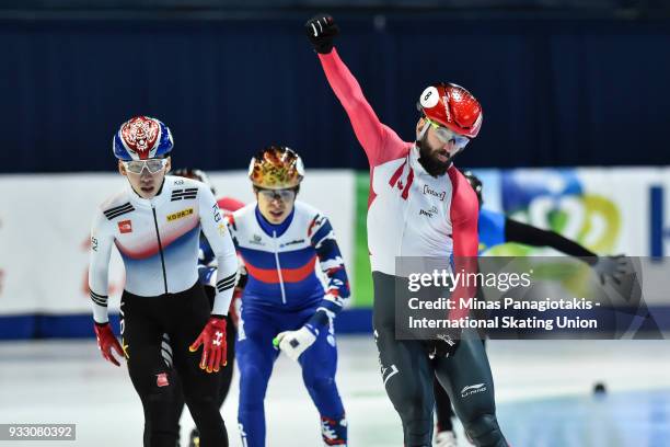 Charles Hamelin of Canada reacts after finishing first in the men's 1500 meter finals during the World Short Track Speed Skating Championships at...