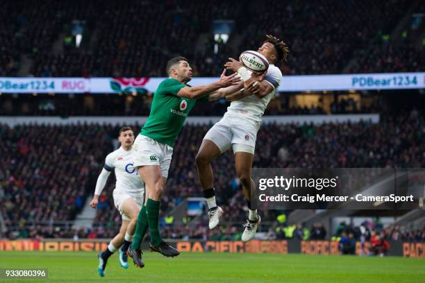 Rob Kearney of Ireland competes for a high ball with Anthony Watson of England which leads to the opening try during the NatWest Six Nations...