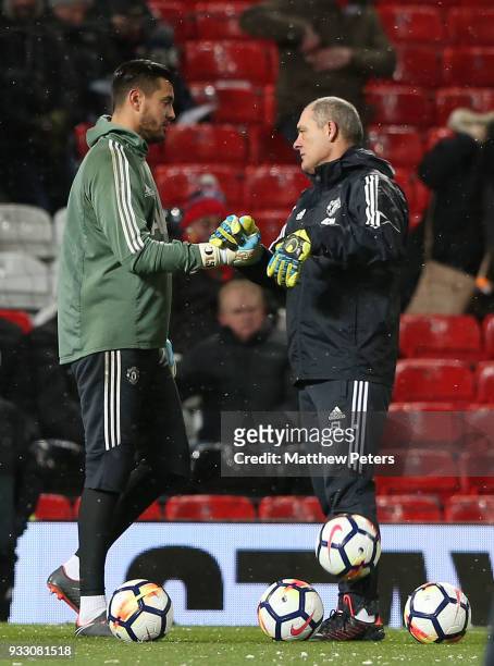 Sergio Romero of Manchester United warms up ahead of the Emirates FA Cup Quarter Final match between Manchester United and Brighton & Hove Albion at...