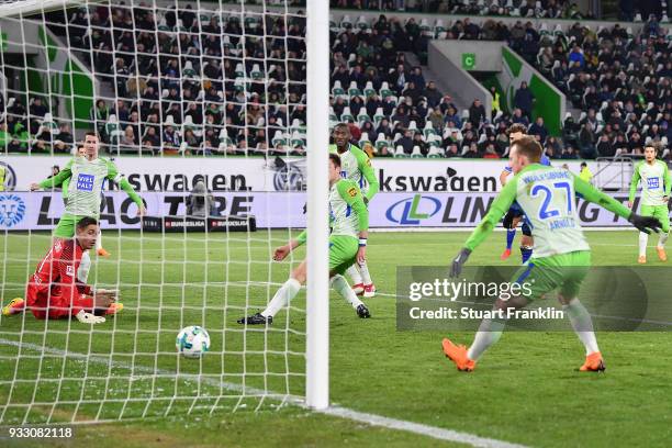 Robin Knoche of Wolfsburg scores an own goal to make it 0:1 during the Bundesliga match between VfL Wolfsburg and FC Schalke 04 at Volkswagen Arena...