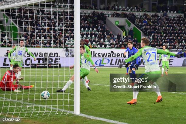 Robin Knoche of Wolfsburg scores an own goal to make it 0:1 during the Bundesliga match between VfL Wolfsburg and FC Schalke 04 at Volkswagen Arena...