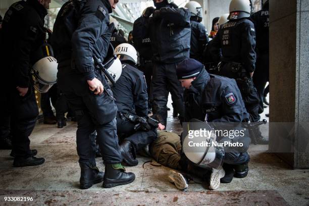 Protestor is being arrested by the police in Hannover, Germany, on 17 March 2017 during the Kurd's protest against the turkish military offensive in...