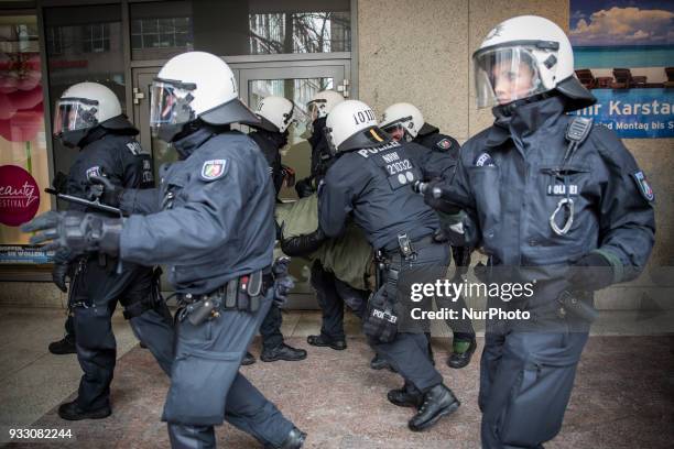 Protestor is being arrested by the police in Hannover, Germany, on 17 March 2017 during the Kurd's protest against the turkish military offensive in...