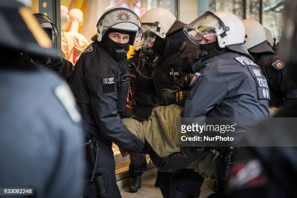 Protestor is being arrested by the police in Hannover, Germany, on 17 March 2017 during the Kurd's protest against the turkish military offensive in...