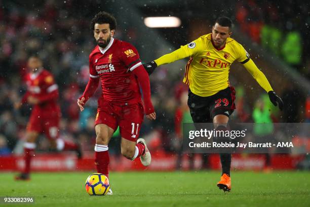 Mohamed Salah of Liverpool and Etienne Capoue of Watford during the Premier League match between Liverpool and Watford at Anfield on March 17, 2018...