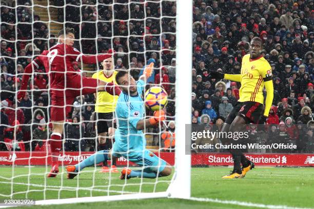 Robert Firmino of Liverpool scores their 3rd goal during the Premier League match between Liverpool and Watford at Anfield on March 17, 2018 in...
