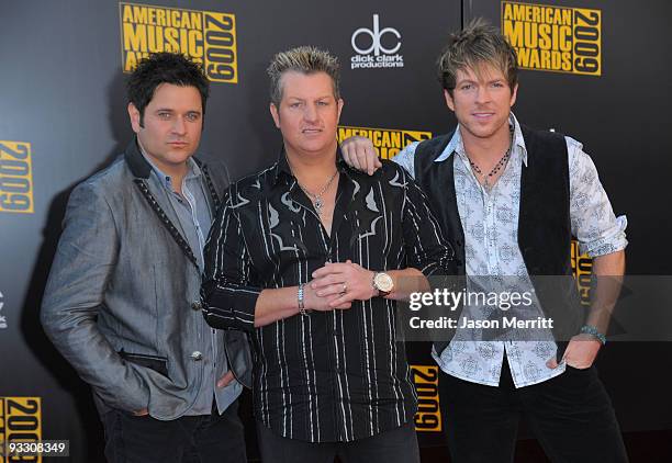 Musicians Jay DeMarcus, Gary LeVox and Joe Don Rooney of Rascal Flatts arrive at the 2009 American Music Awards at Nokia Theatre L.A. Live on...