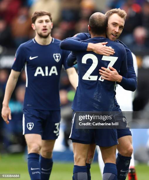 Christian Eriksen of Tottenham Hotspur celebrates with teammate Lucas Moura after scoring his sides third goal during The Emirates FA Cup Quarter...