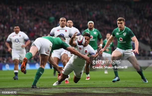 Anthony Watson of England fumbles the ball while later leads to Ireland scoring a try during NatWest Six Nations match between England and Ireland at...