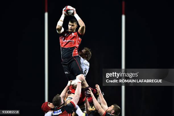 Oyonnaxs Tunisian flanker Bilel Taieb catches the ball in a line out during the French Top 14 rugby union match between Oyonnax and Toulon on March...