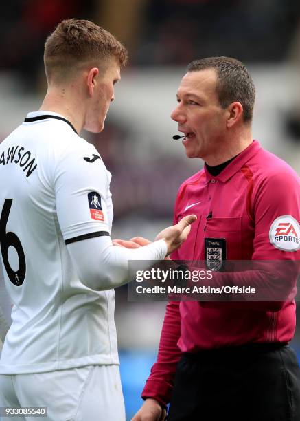 Referee Kevin Friend speaks to Alfie Mawson of Swansea City during the Emirates FA Cup Quarter Final match between Swansea City and Tottenham Hotspur...