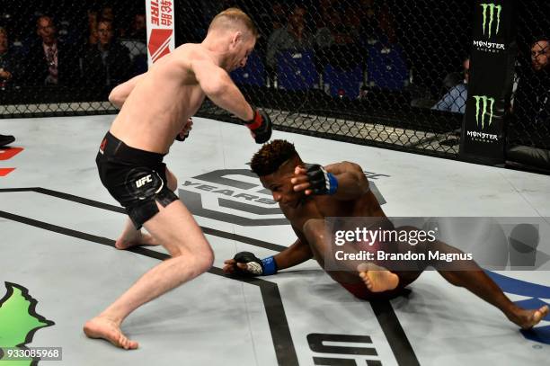 Danny Henry of Scotland knocks down Hakeem Dawodu in their featherweight bout inside The O2 Arena on March 17, 2018 in London, England.
