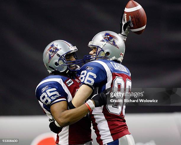 Brian Bratton of the Montreal Alouettes celebrates his touchdown with Ben Cahoon during the Eastern Finals against the B.C Lions at Olympic Stadium...