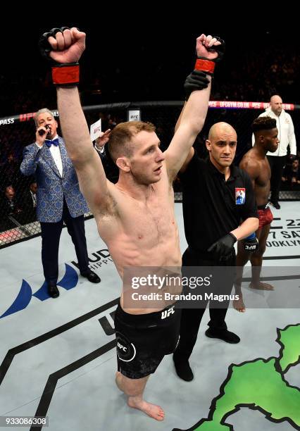 Danny Henry of Scotland celebrates after defeating Hakeem Dawodu by submission in their featherweight bout inside The O2 Arena on March 17, 2018 in...