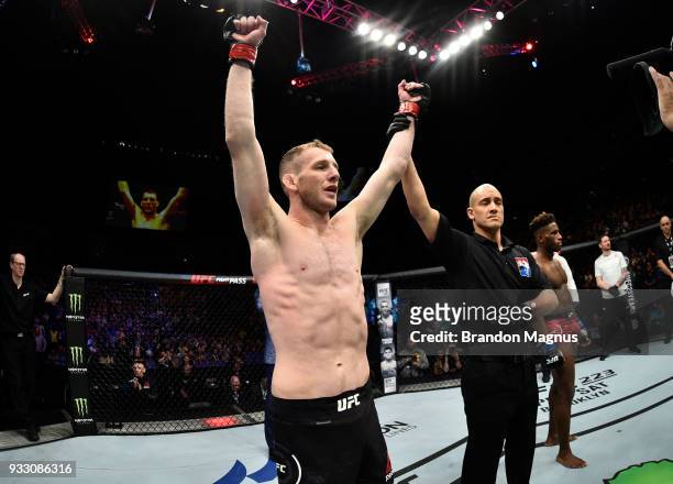 Danny Henry of Scotland celebrates after defeating Hakeem Dawodu by submission in their featherweight bout inside The O2 Arena on March 17, 2018 in...
