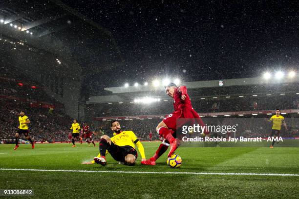 General view of match action at Anfield, the home stadium of Liverpool under snow during the Premier League match between Liverpool and Watford at...