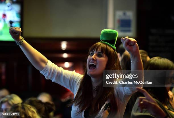 Ireland rugby fans celebrate at the final whistle as they watch a television screen as Ireland defeat England in the Six Nations rugby championship...