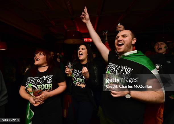 Ireland rugby fans celebrate at the final whistle as they watch a television screen as Ireland defeat England in the Six Nations rugby championship...