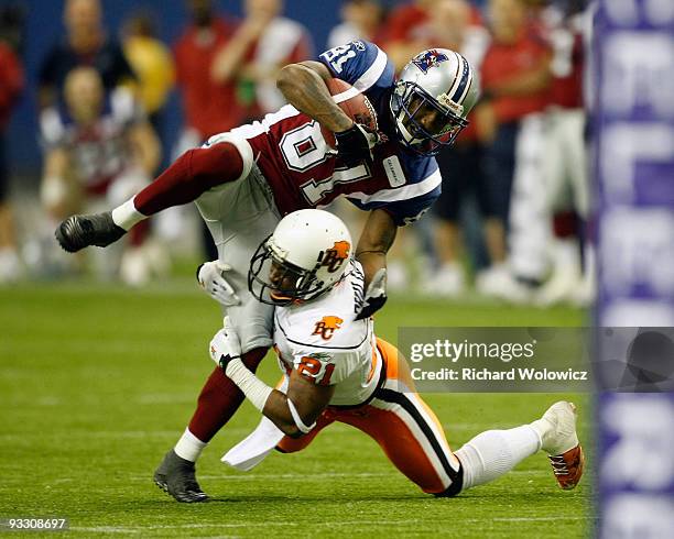 Ryan Phillips of the B.C Lions tackles Kerry Watkins of the Montreal Alouettes during the Eastern Finals at Olympic Stadium on November 22, 2009 in...