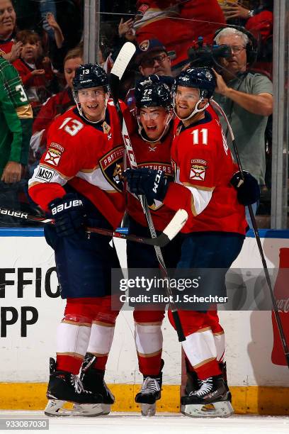 Frank Vatrano of the Florida Panthers celebrates his goal with teammates Mark Pysyk and Jonathan Huberdeau during the second period against the...